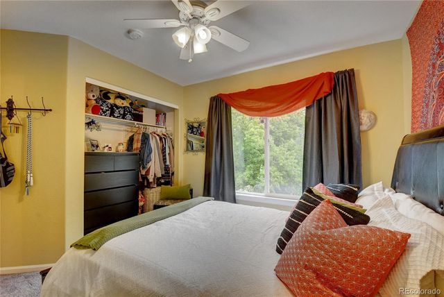 a bed room with a bed and a window