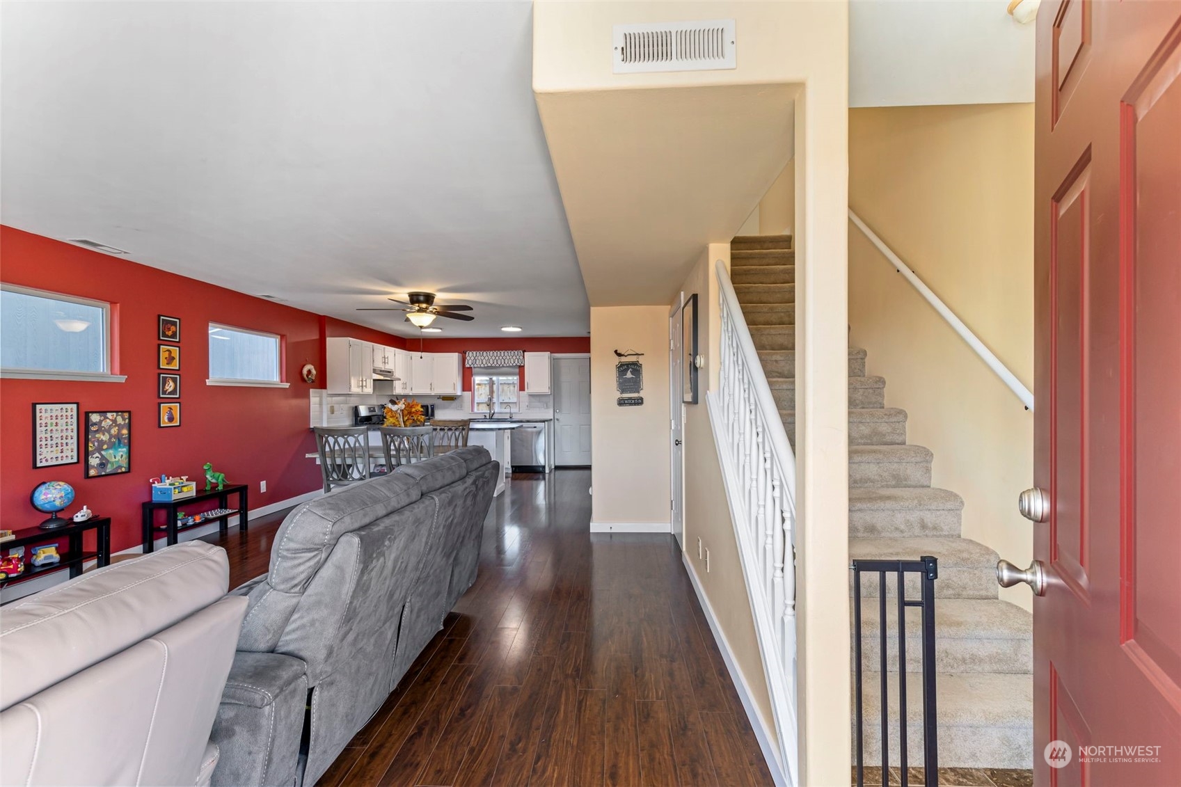 3957 Broadmoor Loop Bremerton, WA 98310 - Photo 3 of 23 a view of a living room with furniture and stairs