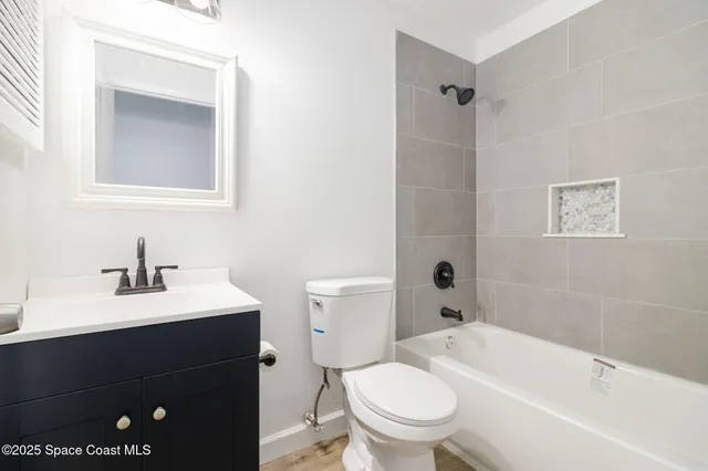 a bathroom with a sink a toilet and a bathtub