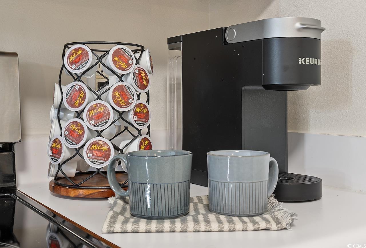 1204 River Oaks Drive, Unit 25D Myrtle Beach, SC 29579 - Photo 12 of 31 Kitchen view of a textured wall