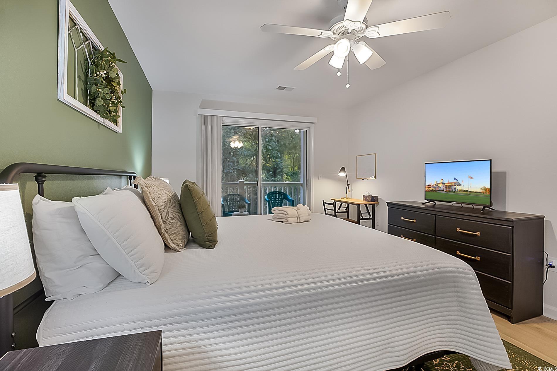 1204 River Oaks Drive, Unit 25D Myrtle Beach, SC 29579 - Photo 15 of 31 Bedroom featuring access to exterior and a ceiling fan