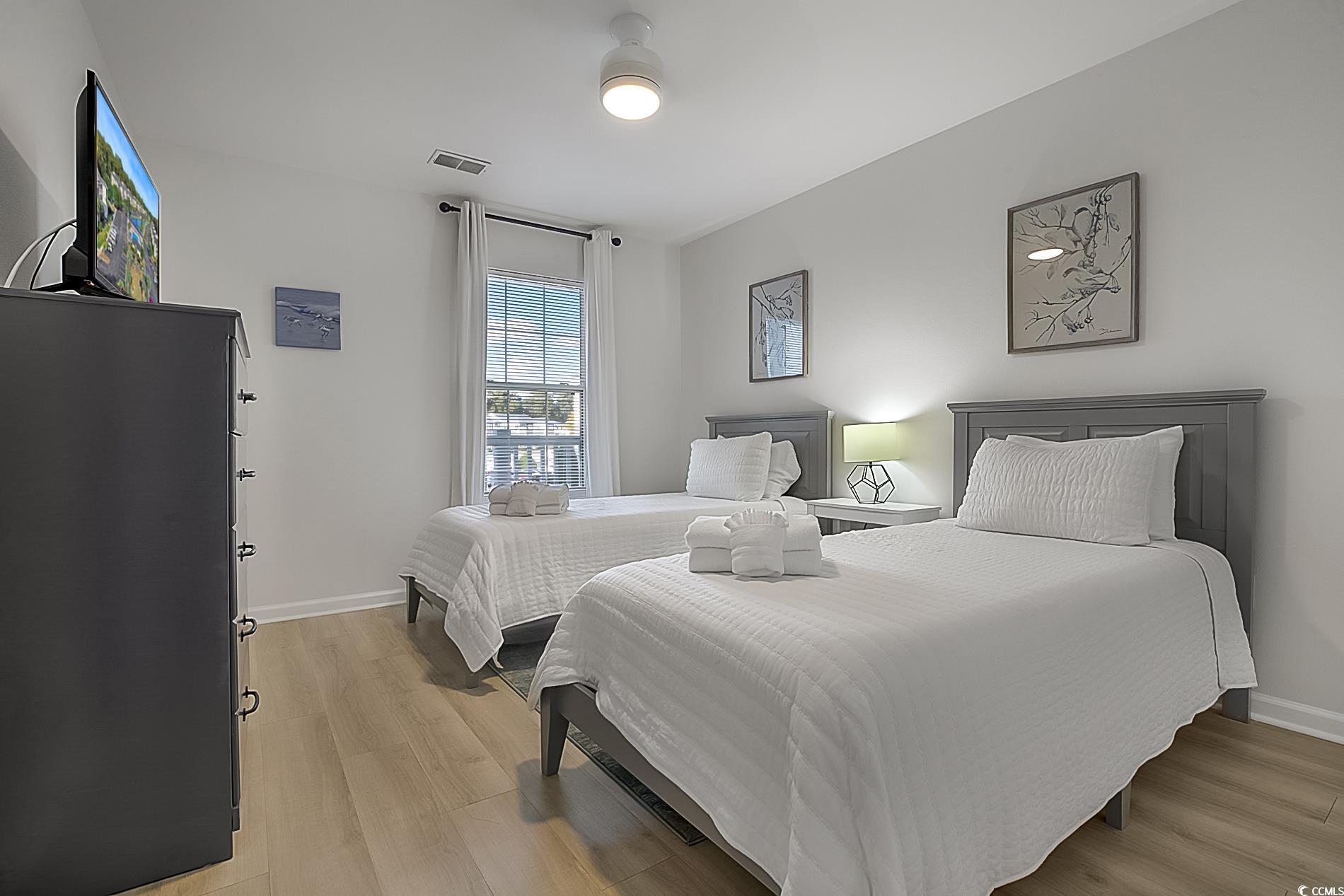 1204 River Oaks Drive, Unit 25D Myrtle Beach, SC 29579 - Photo 23 of 31 Bedroom featuring light wood finished floors and baseboards
