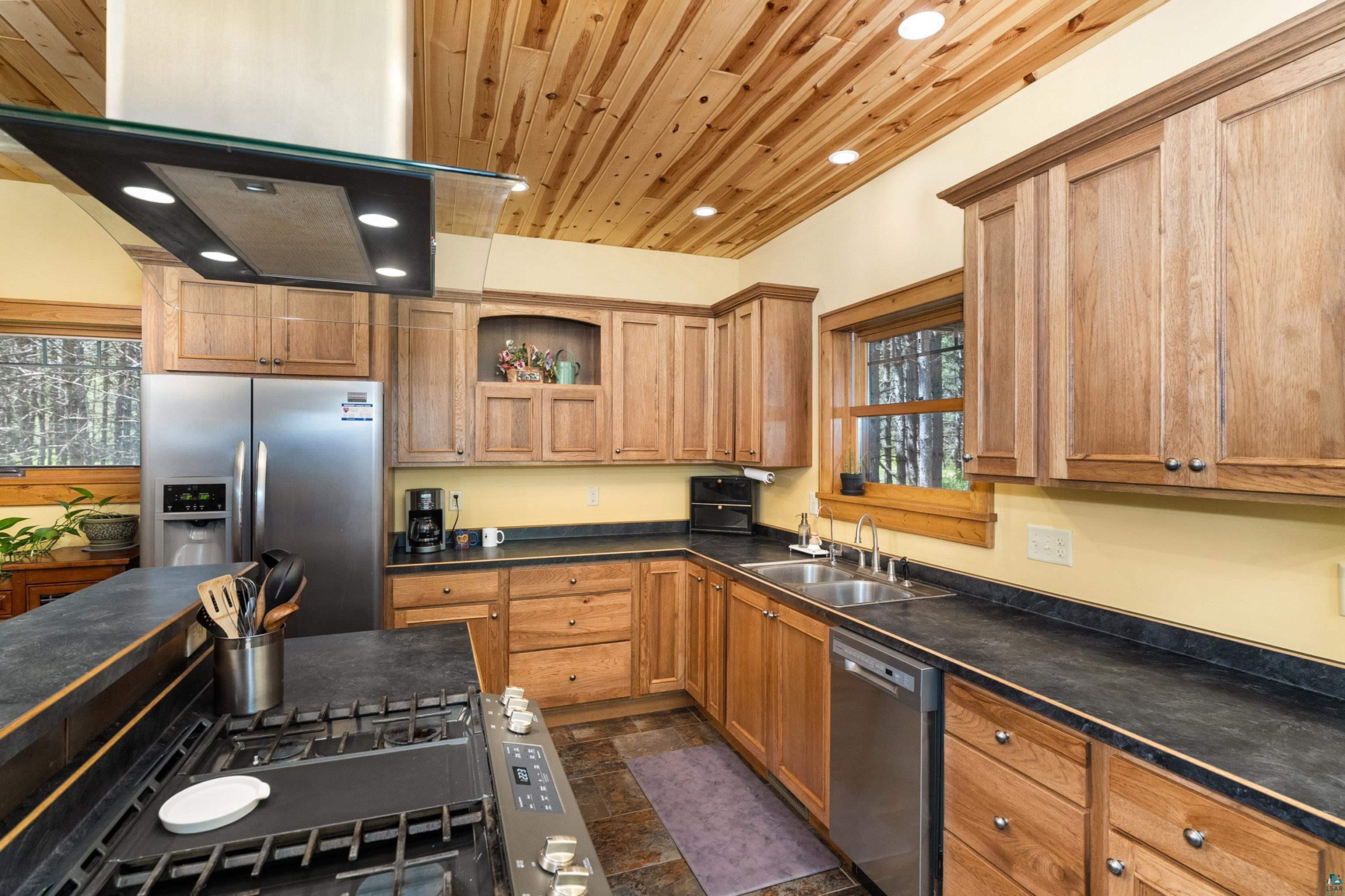 75 East Stark Road Esko, MN 55733 - Photo 20 of 87 Kitchen featuring wood-finish cabinetry and a complementary wood plank ceiling