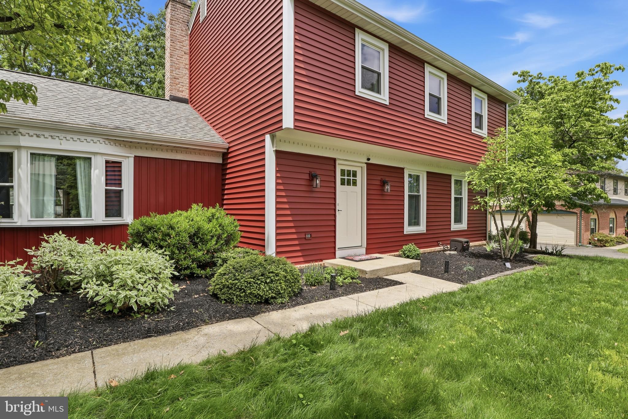 1072 Lambley Road Landisville, PA 17538 - Photo 5 of 46 a front view of a house with a yard and potted plants