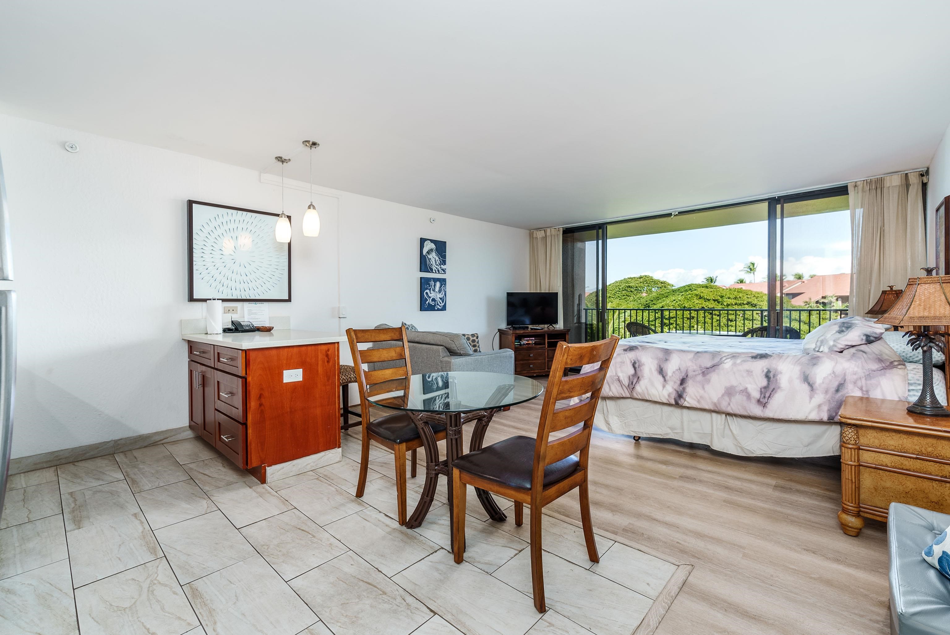 3445 Lower Honoapiilani Road, Unit 434 Lahaina, HI 96761 - Photo 13 of 46 a living room with furniture and a large window