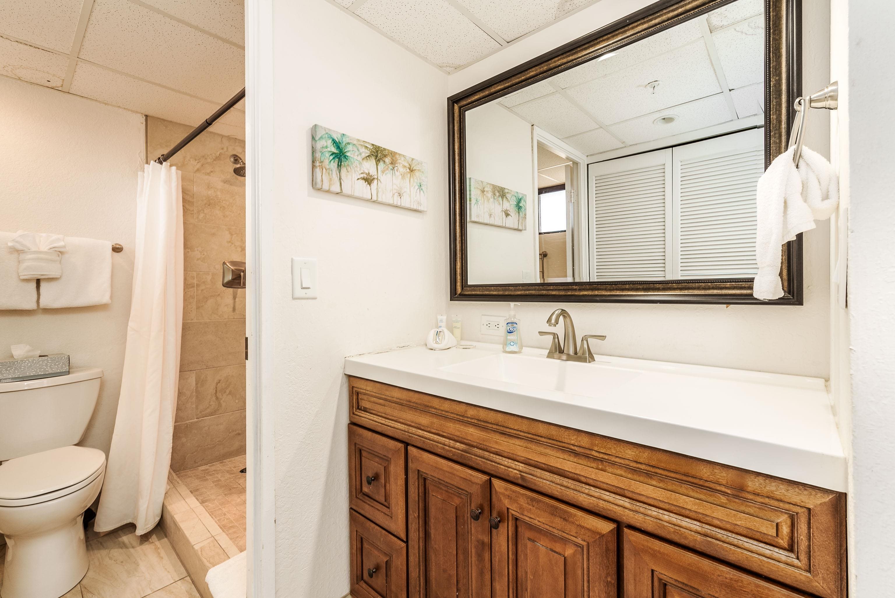 3445 Lower Honoapiilani Road, Unit 434 Lahaina, HI 96761 - Photo 17 of 46 a bathroom with a granite countertop sink toilet and shower