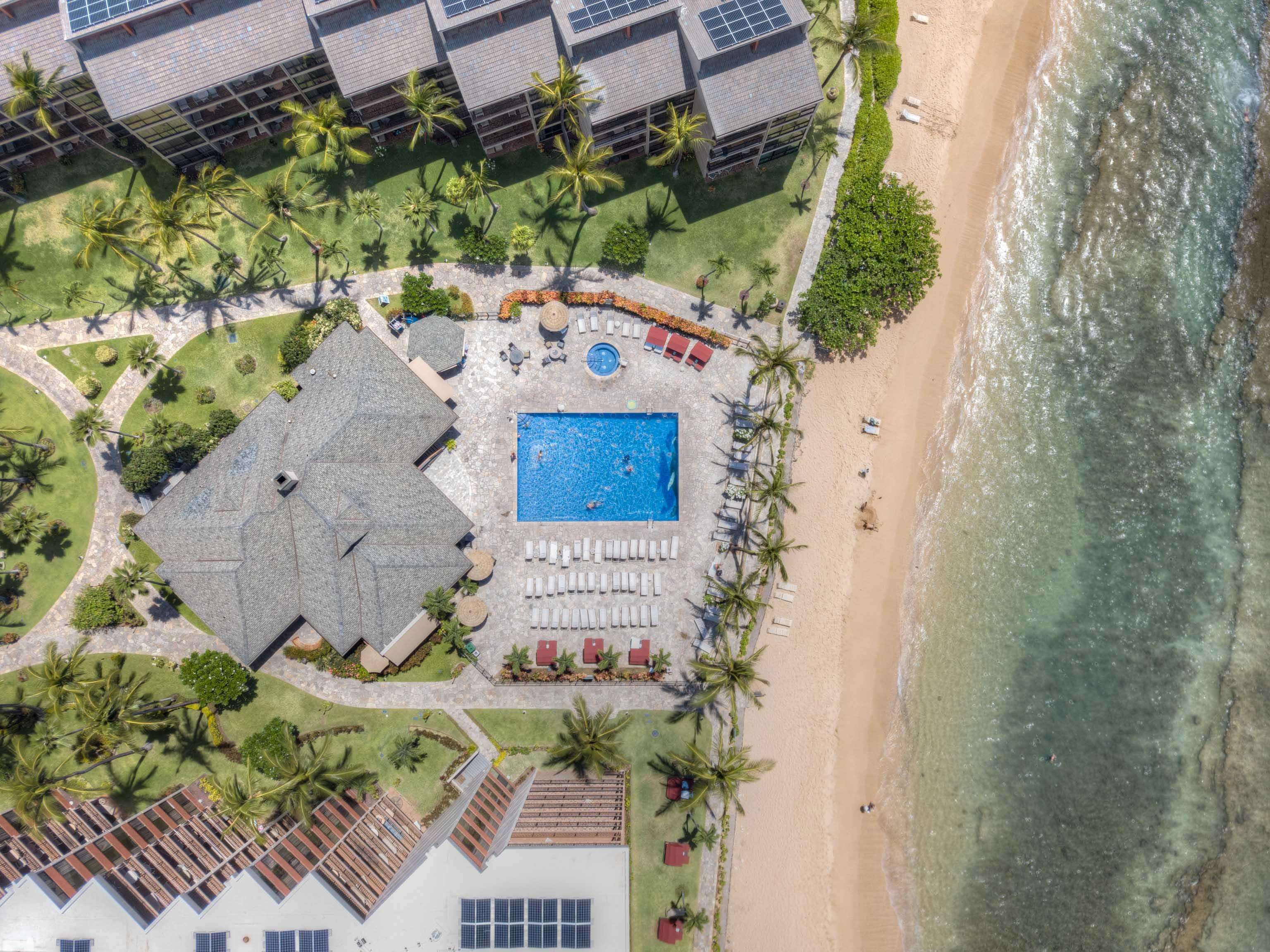 3445 Lower Honoapiilani Road, Unit 434 Lahaina, HI 96761 - Photo 32 of 46 an aerial view of a house with a yard