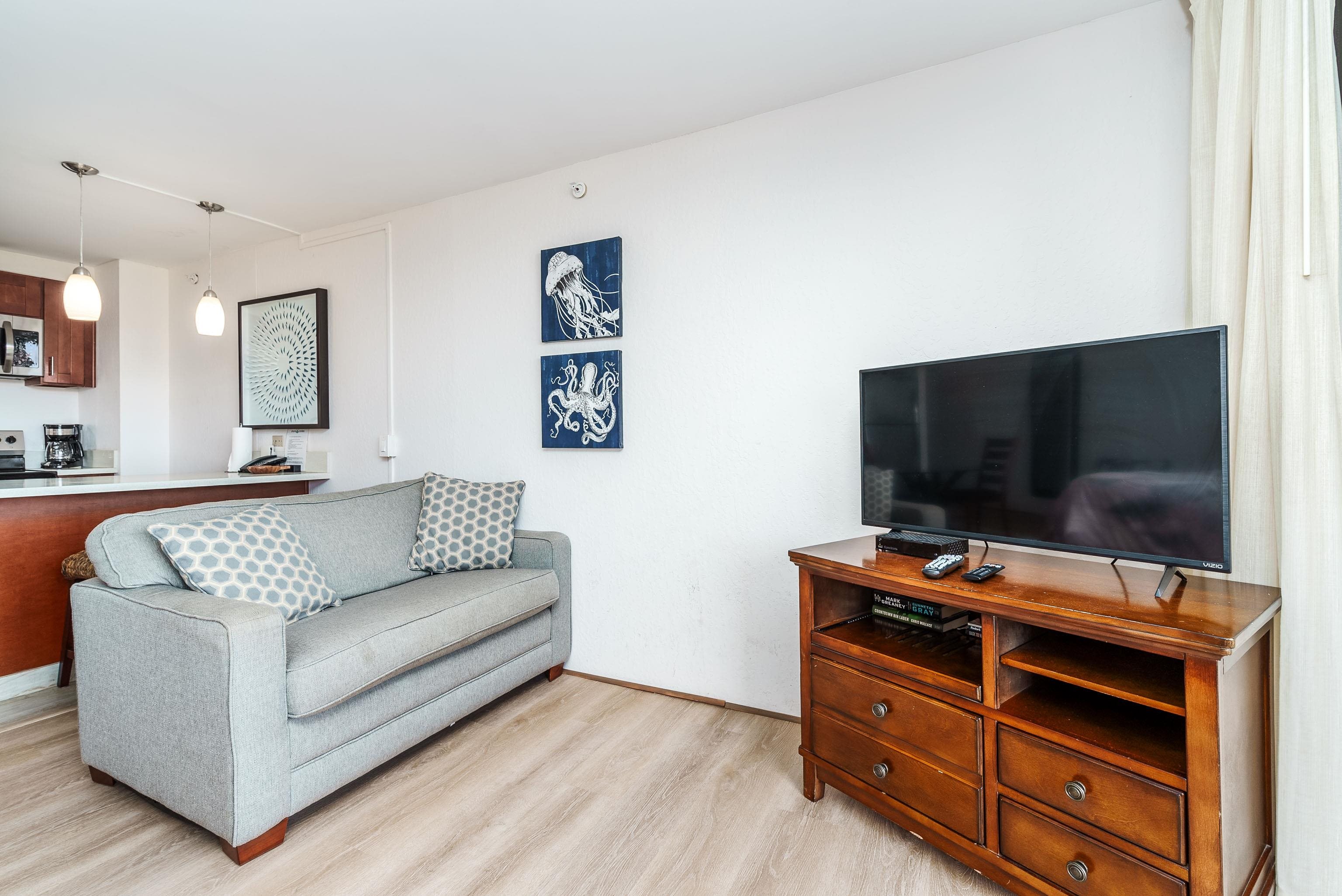 3445 Lower Honoapiilani Road, Unit 434 Lahaina, HI 96761 - Photo 7 of 46 a living room with furniture and a flat screen tv