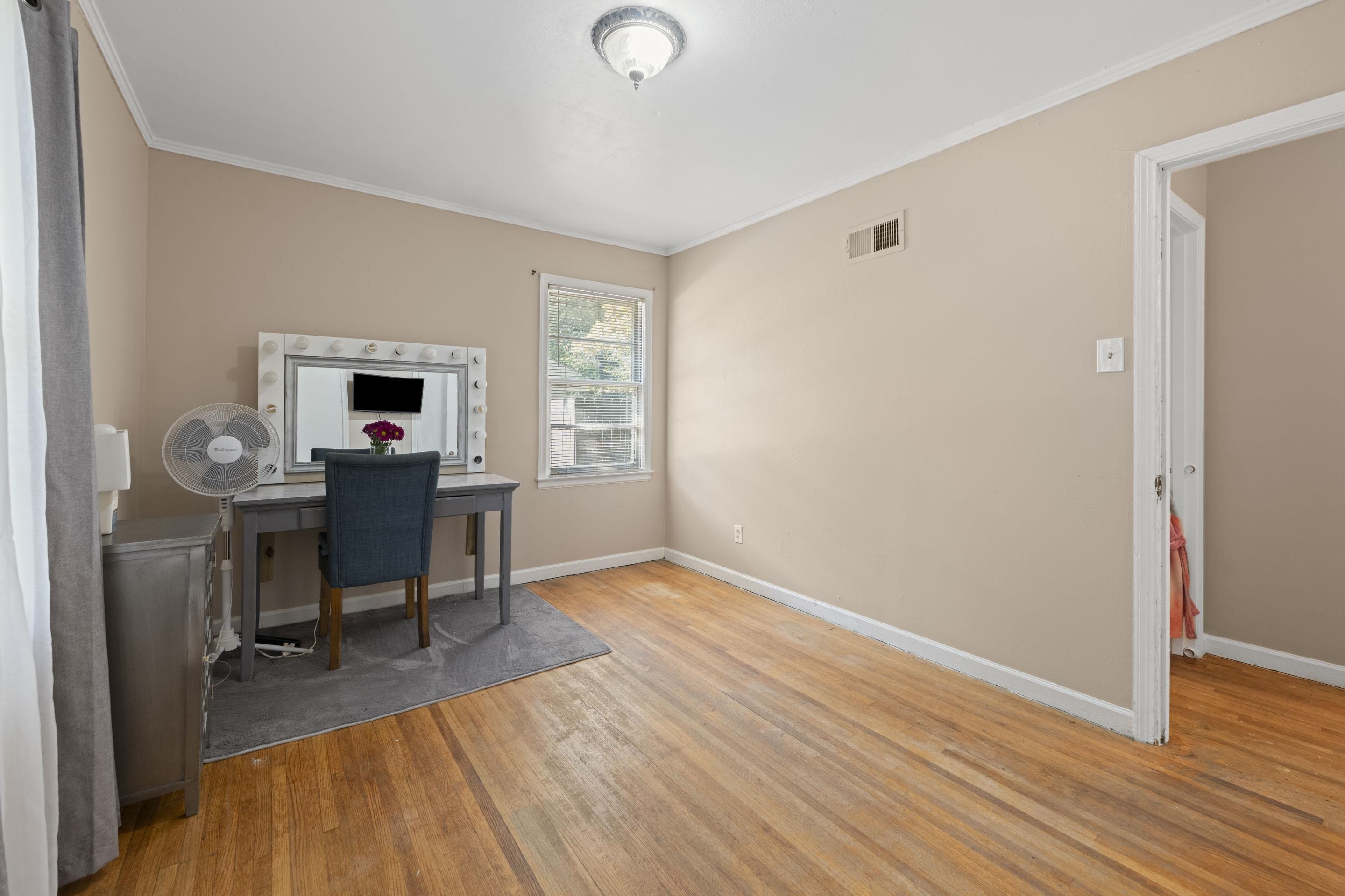 1597 Marcia Road Memphis, TN 38117 - Photo 14 of 19 a view of a workspace with furniture and a window