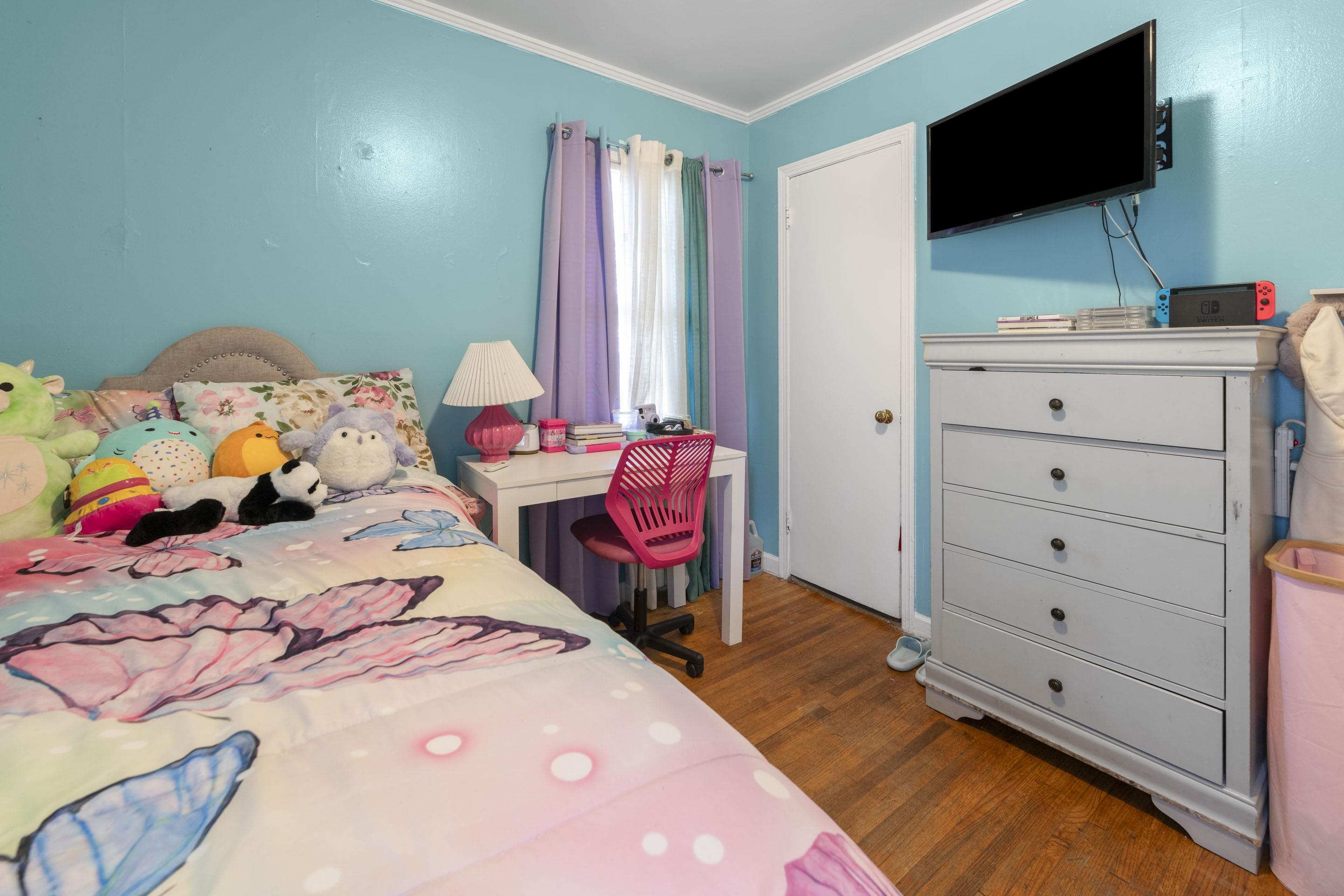 1597 Marcia Road Memphis, TN 38117 - Photo 17 of 19 a bedroom with a bed and flat screen tv