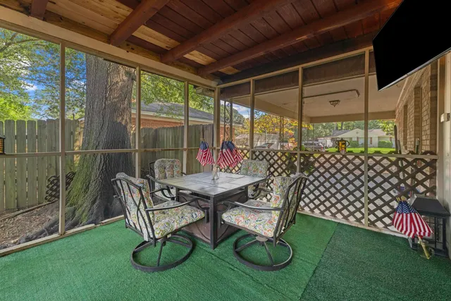 a view of yard with patio