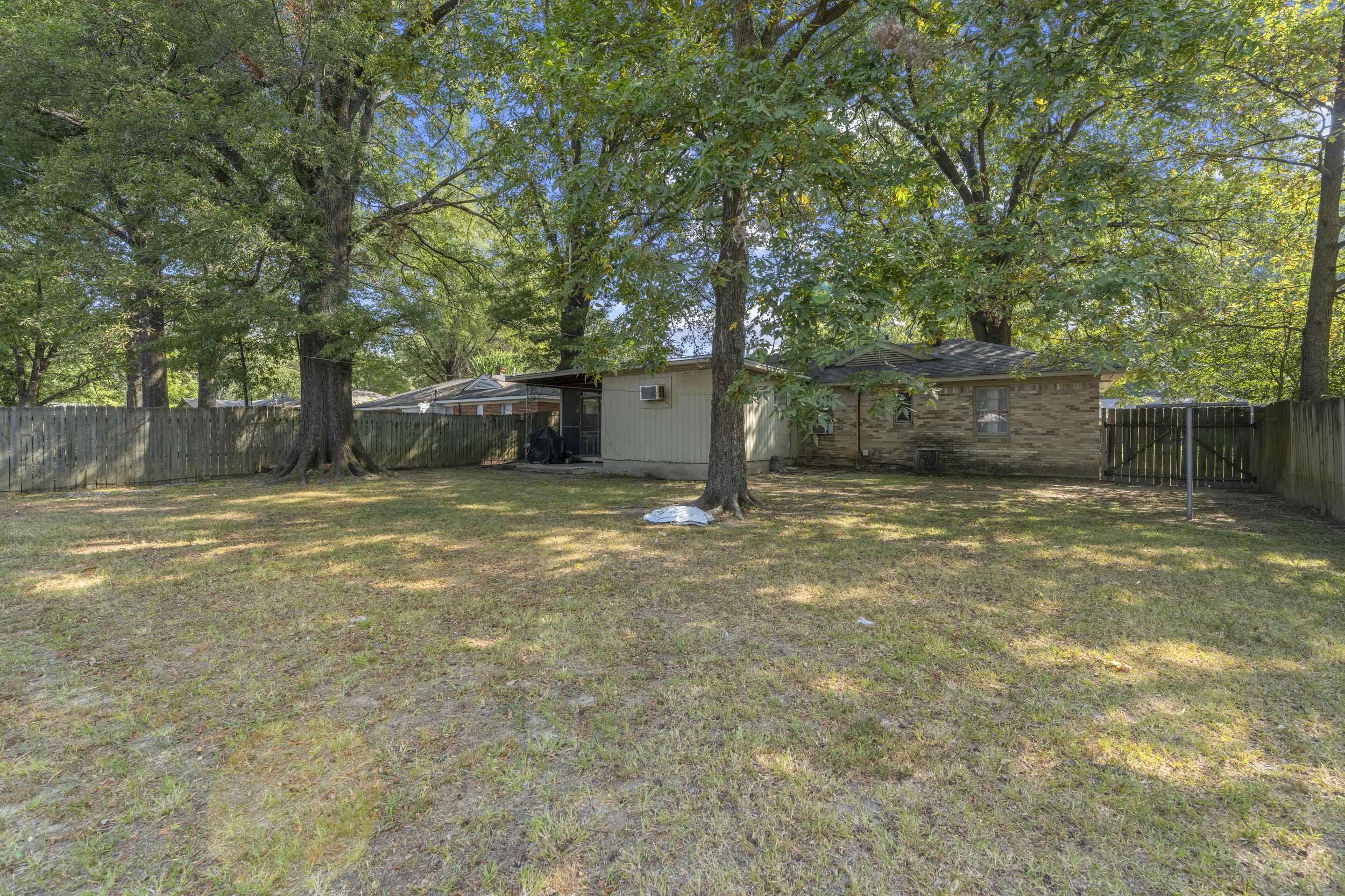1597 Marcia Road Memphis, TN 38117 - Photo 6 of 19 a view of a backyard with a garden