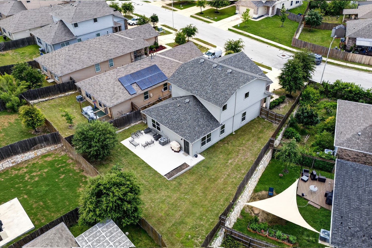 2006 Grow Lane Austin, TX 78754 - Photo 28 of 40 An aerial perspective reveals a private fenced yard with a spacious patio, ideal for outdoor gatherings.
