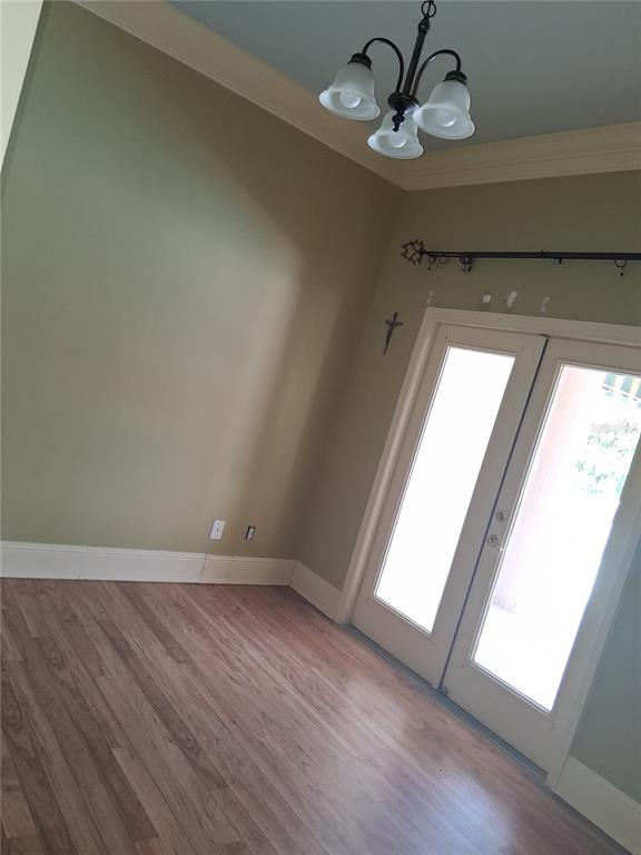 915 Old Welcome Road Lithia, FL 33547 - Photo 11 of 23 a view of empty room with wooden floor and fan