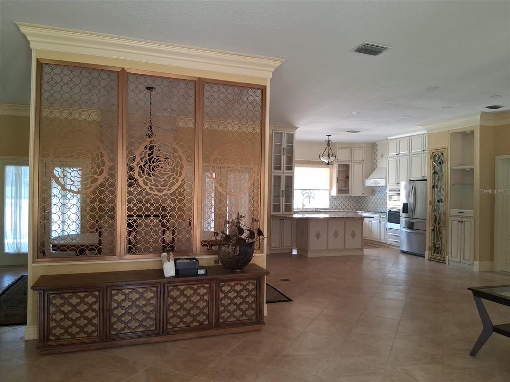 915 Old Welcome Road Lithia, FL 33547 - Photo 4 of 23 a living room with furniture and a large window