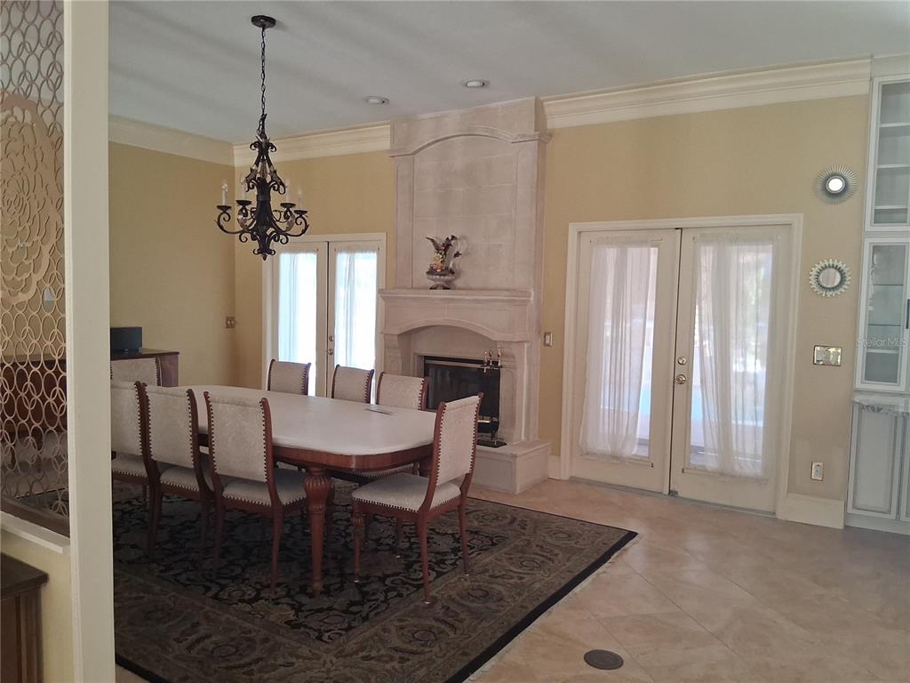 915 Old Welcome Road Lithia, FL 33547 - Photo 8 of 23 a dining room with furniture window and wooden floor