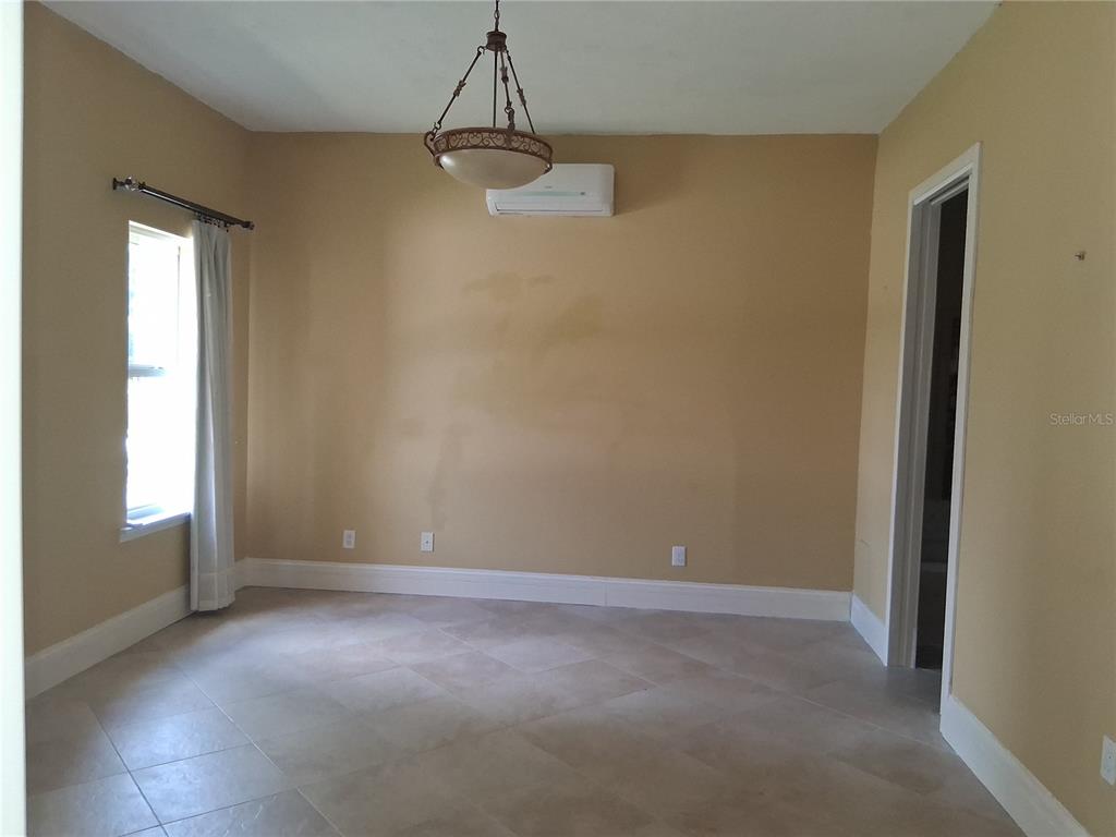 915 Old Welcome Road Lithia, FL 33547 - Photo 9 of 23 a view of an empty room with a window