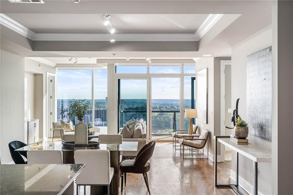 3630 Peachtree Road Northeast, Unit 1902 Atlanta, GA 30326 - Photo 1 of 1 a living room with furniture and large windows