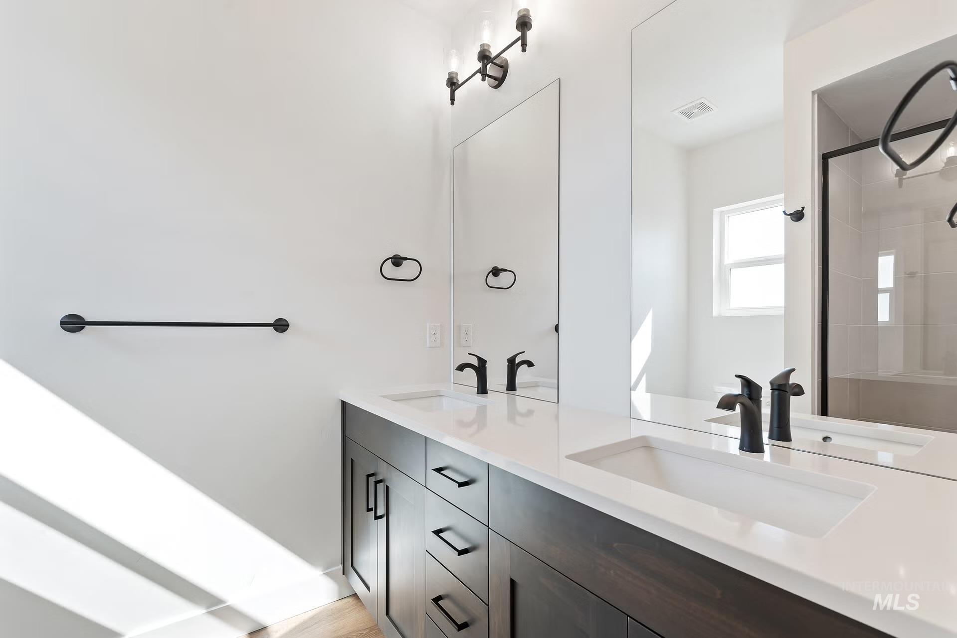 716 South Calhoun Lane Star, ID 83669 - Photo 12 of 23 Full bath featuring double vanity and a stall shower