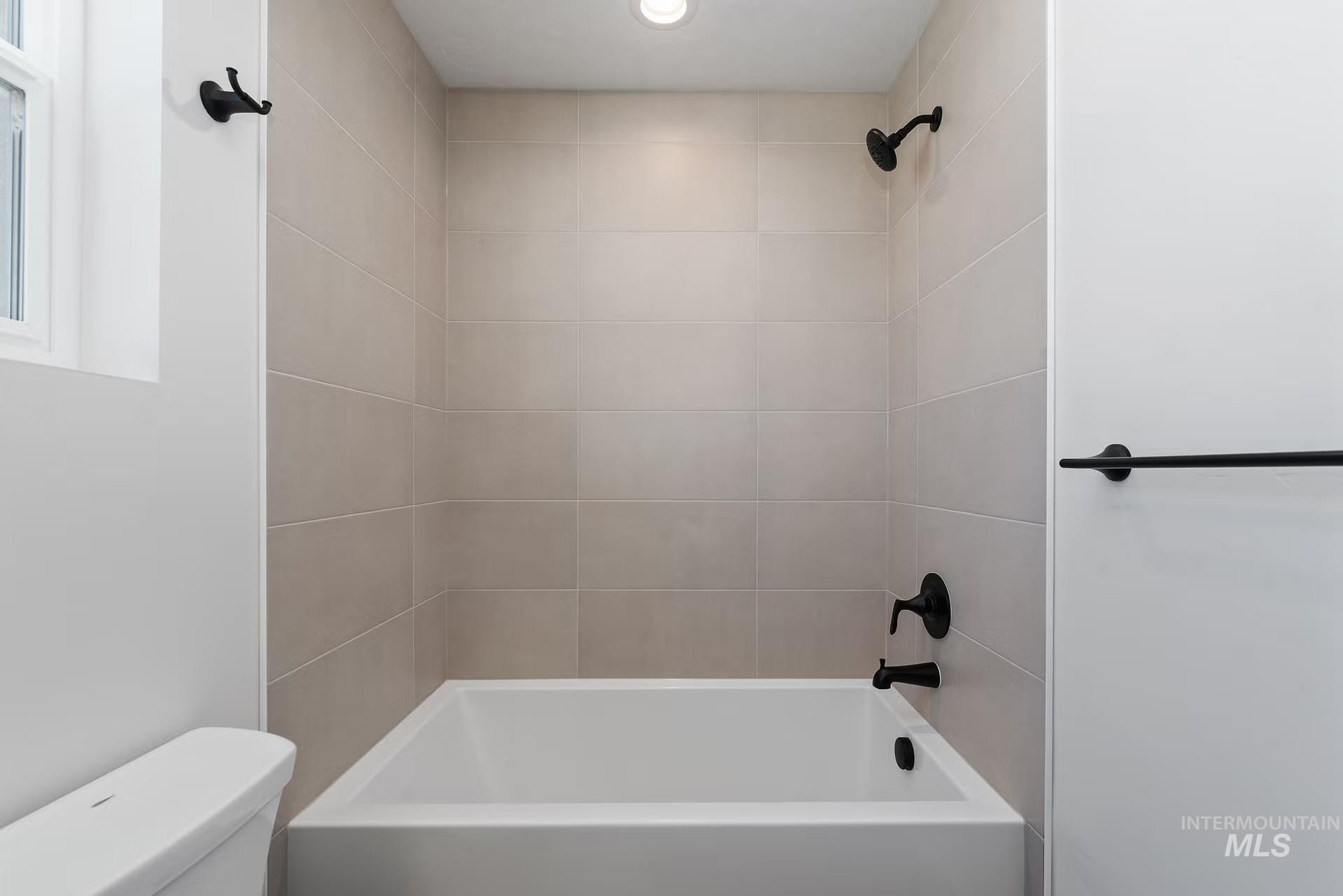 716 South Calhoun Lane Star, ID 83669 - Photo 17 of 23 Bathroom with shower / washtub combination and toilet