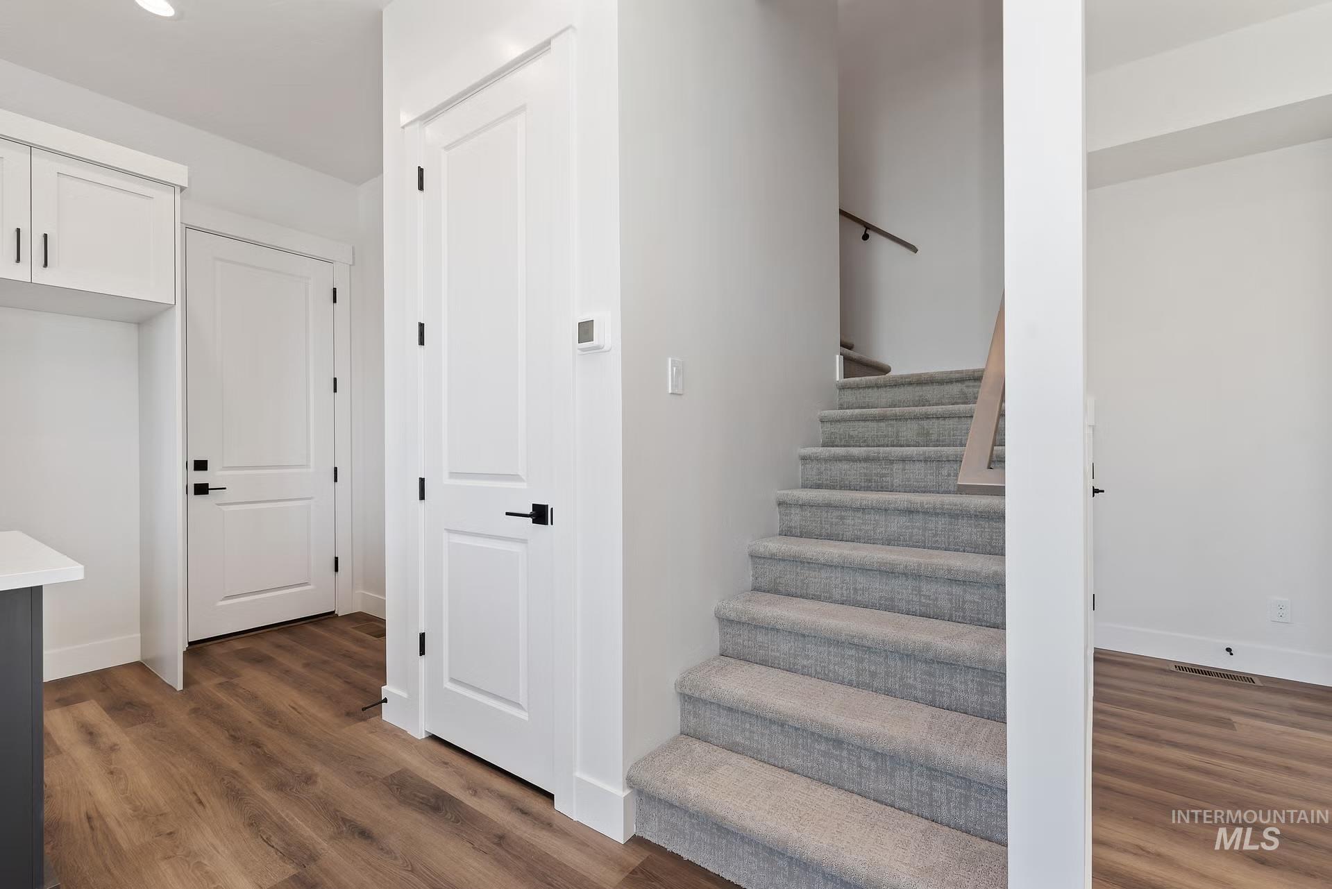 716 South Calhoun Lane Star, ID 83669 - Photo 9 of 23 Staircase with wood finished floors and baseboards
