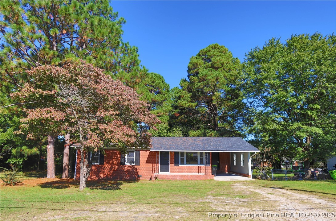 222 Odell Road Spring Lake, NC 28390 - Photo 1 of 17 front view of a house with a swimming pool
