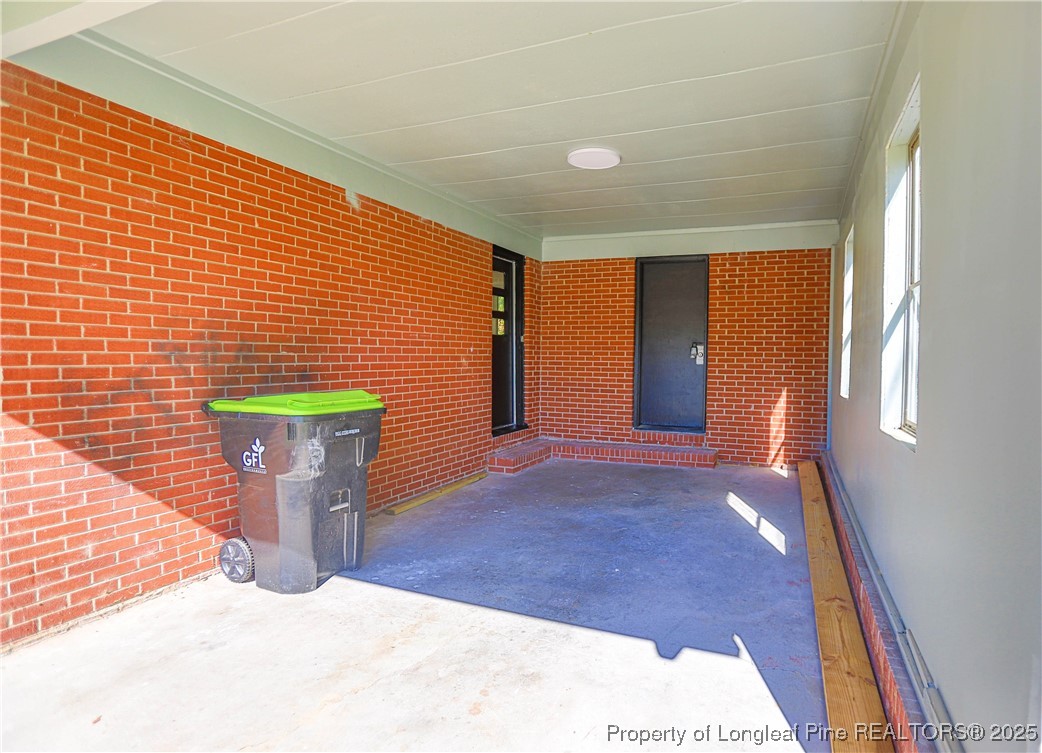 222 Odell Road Spring Lake, NC 28390 - Photo 2 of 17 a view of a door and chair in the room