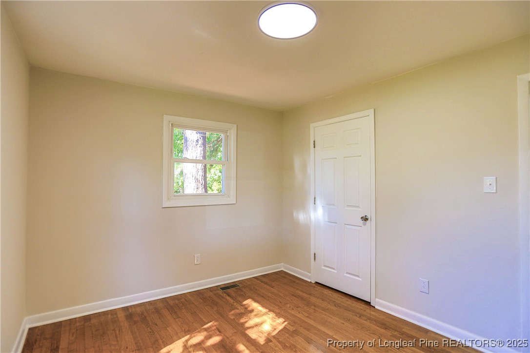 222 Odell Road Spring Lake, NC 28390 - Photo 10 of 17 an empty room with windows