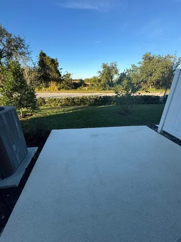 a view of a lake with a big yard