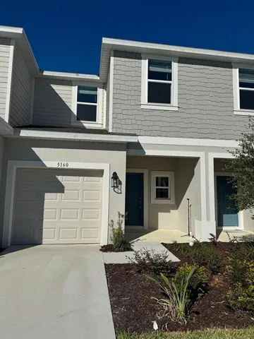 a view of a house with a garage