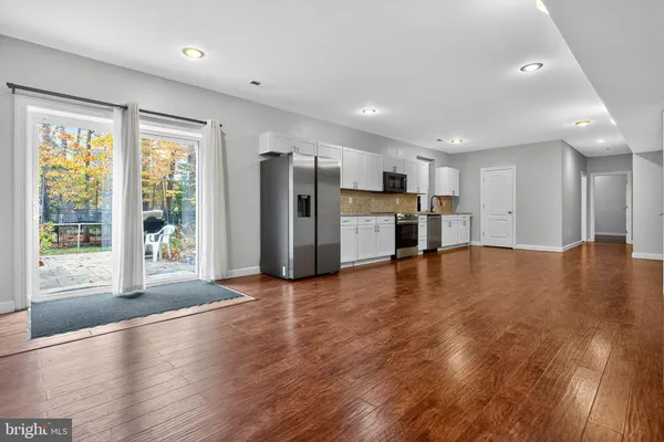 a room with wooden floor and shoes