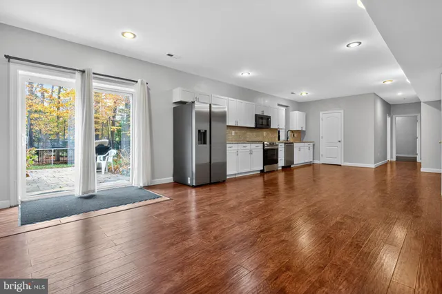 a room with wooden floor and shoes
