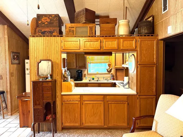 a bathroom with a sink a mirror and shower