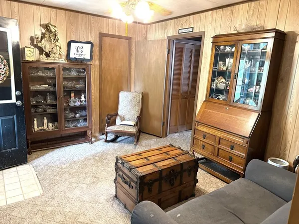 a living room with furniture and large window