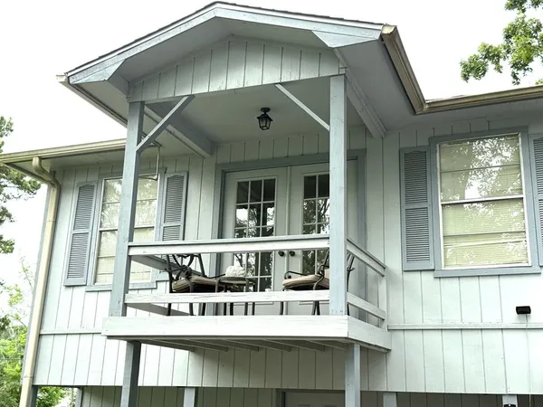 a front view of a house with glass windows and entrance