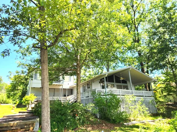 a house with trees in the background