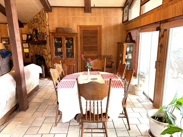 a view of a patio with table and chairs