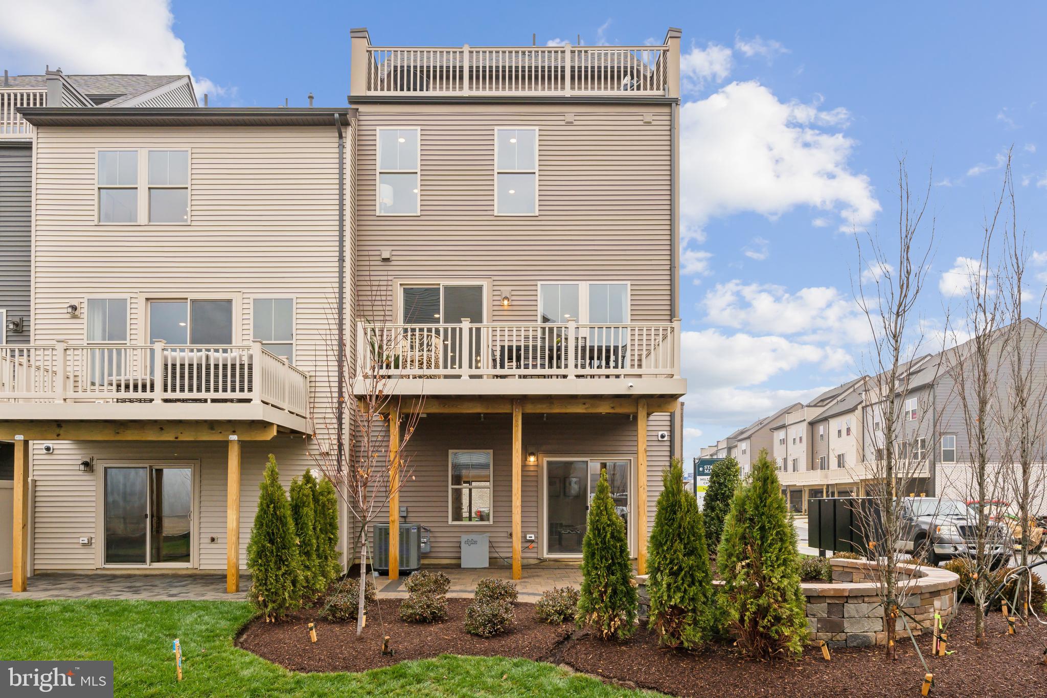 3603 St Amy Way Bowie, MD 20716 - Photo 22 of 42 a front view of a building with garden
