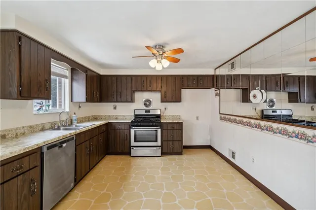 a kitchen with a sink stove and cabinets