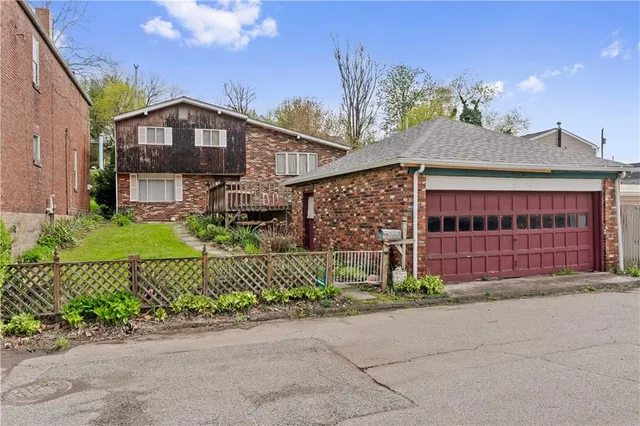 front view of a house with a garden