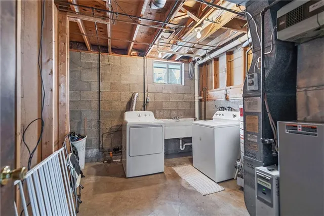 aerial view of a house with garden space and parked car