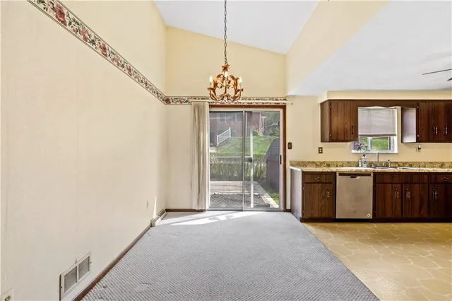a very nice looking open kitchen with a sink