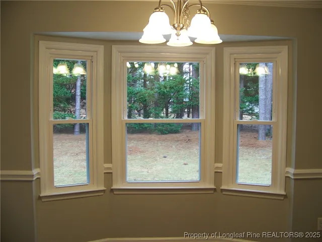 a view closed kitchen with a sink and granite top