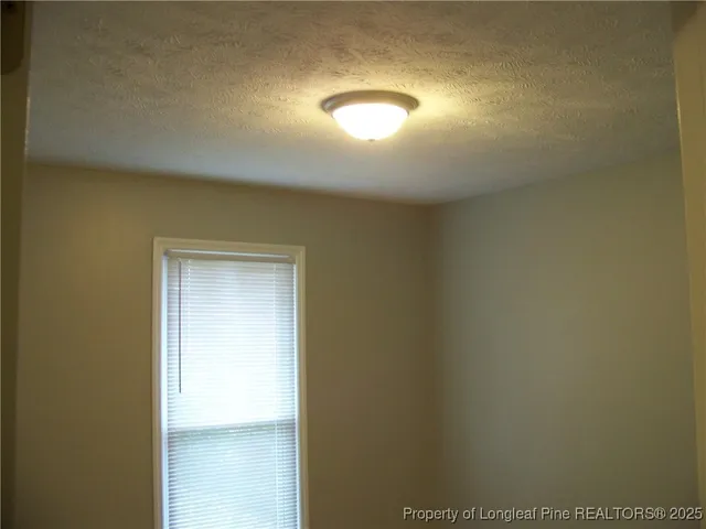 a kitchen with granite countertop a sink and a window