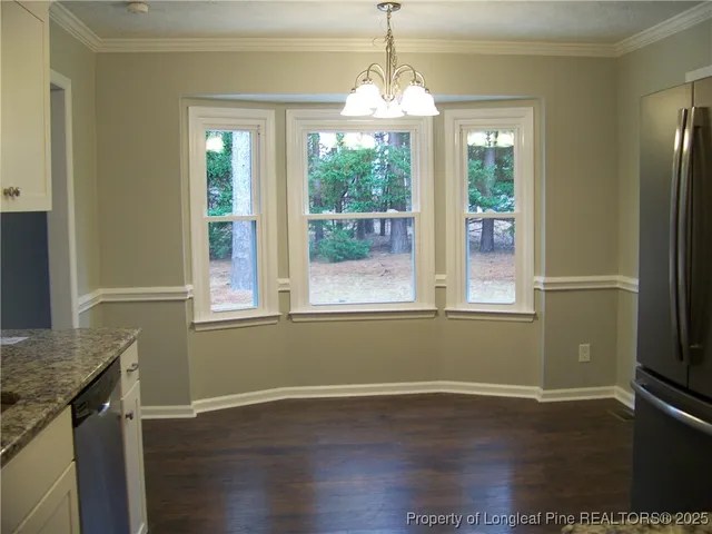 a kitchen with stainless steel appliances a stove a microwave and sink