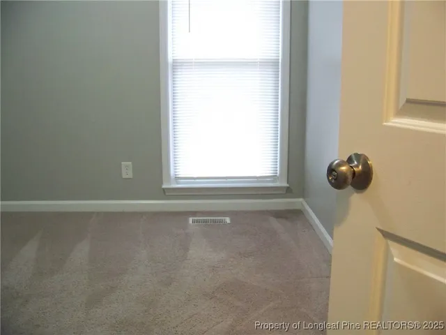 a bathroom with a toilet and a bathtub