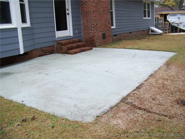 a house that has a tree in front of it