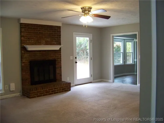 a view of a room that has a large window
