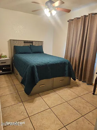 a bedroom with a bed and a shower