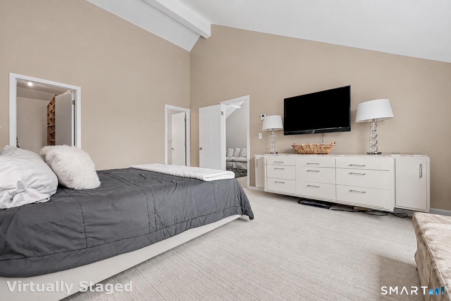 690 Forest Road, Unit 642 West Haven, CT 06516 - Photo 21 of 40 Cathedral ceiling creates a sense of serenity in the Primary bedroom. Walk in closet to left in this photo